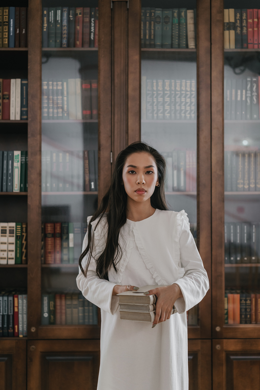 A Woman Carrying Books